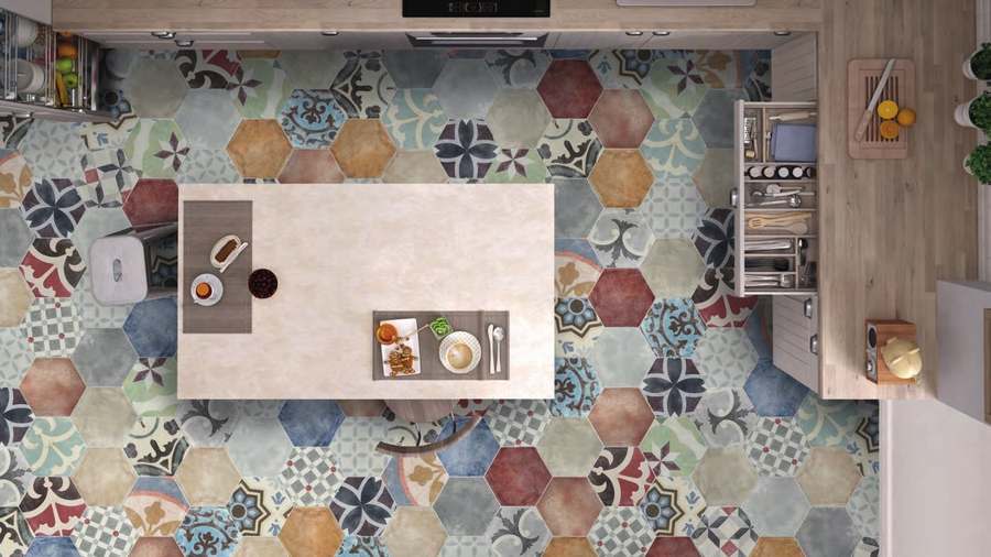 Cocina vista desde arriba, con isla y suelo de hexágonos de porcelánico de colores decorados